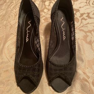 Black Satin Spike heels for evening ware. Used but in very good condition.